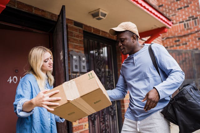 Delivery man speaking with a customer